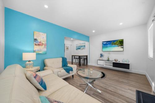 a living room with a couch and a table at Villa Mia Cozy Home in the heart of Miami in Miami