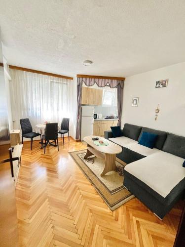 a living room with a couch and a table at Apartment Sara in Mostar