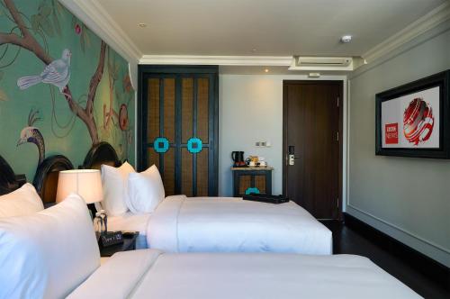 Katil atau katil-katil dalam bilik di Hoi An Delicacy Hotel & Spa