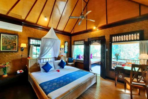 a bedroom with a large bed in a room at Jivaa 1 BR Superior Garden View ZN239 in Ubud