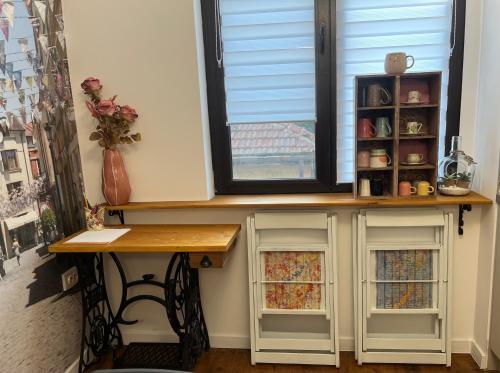 a window sill with a desk in a room at Diva Kapana 2BDR Apartment with parking in Plovdiv