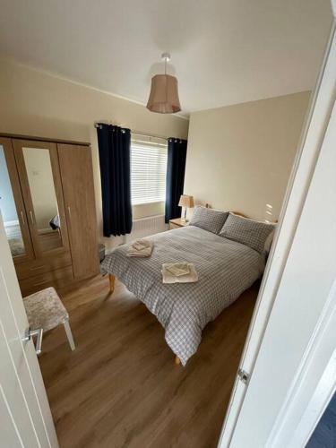 a bedroom with a large bed in a room at 3 bed country home near Omagh in Seskinore