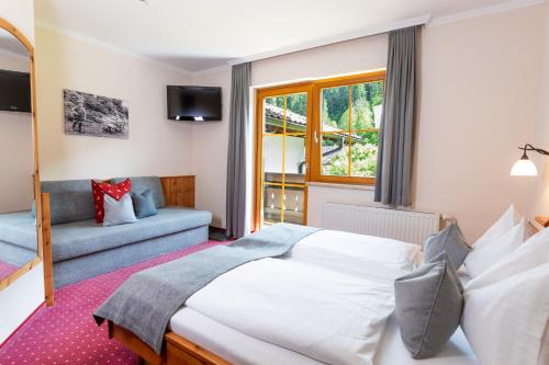 Postel nebo postele na pokoji v ubytování Gästehaus Pilz Schladming