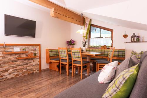 a living room with a couch and a table at Gästehaus Pilz Schladming in Schladming