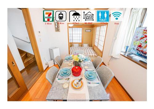 a dining room with a long table with blue dishes at Asakusa-Ginza-Skytree-Stn-4min-95sqm-Garage-2WC-2Swr in Tokyo