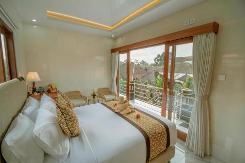 Postel nebo postele na pokoji v ubytování Ashanti Guest House Ubud