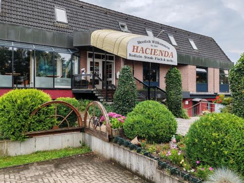 a restaurant with a sign that reads hazarbarma at Sterne Luxus Heidesonne in Jesteburg
