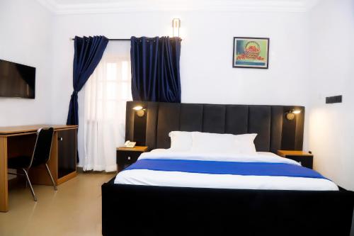 Cama o camas de una habitación en Western Dreams Hotel