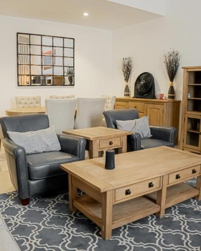 a living room with two chairs and a coffee table at 3BR villa and maid room by escape time in Sharm