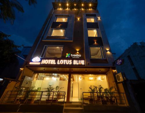 a building with a sign that reads motel louis club at Treebo Lotus Blue in Bhopal