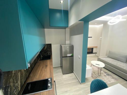 Kuchyň nebo kuchyňský kout v ubytování RentRoom Ajan Apartment
