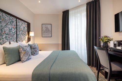 Ένα ή περισσότερα κρεβάτια σε δωμάτιο στο Hotel Park Lane Paris