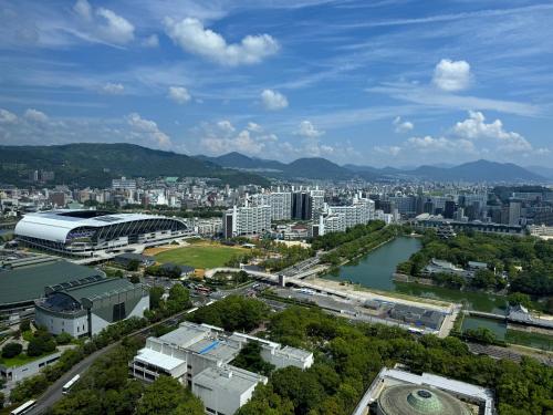 an aerial view of a city with buildings and a river at Rihga Royal Hotel Hiroshima in Hiroshima