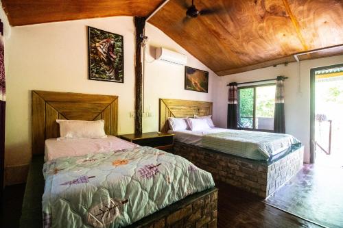 Postel nebo postele na pokoji v ubytování Wild Planet Eco Retreat