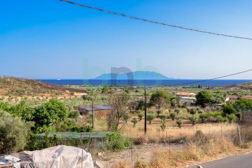 a view of a road with mountains in the distance at Thea Dikella in Dhíkella