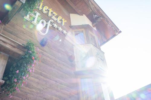 a building with a sign on the side of it at Hotel Rietzer Hof in Rietz