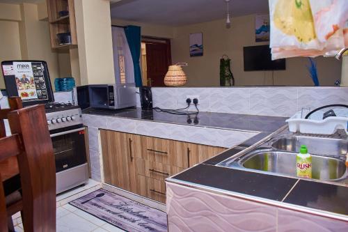 Kuchyň nebo kuchyňský kout v ubytování Ligen Suites
