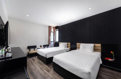 Кровать или кровати в номере Ocean Star Da Nang Bay Hotel