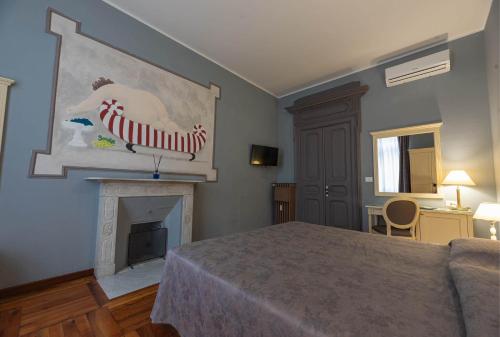 a bedroom with a bed and a fireplace at Apartments Torino Porta Susa PLUS in Turin