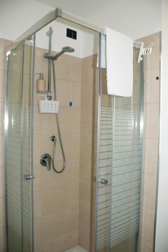 a shower with a glass door in a bathroom at B&B Il Giardino di Circe - Filadelfia (VV) in Filadelfia