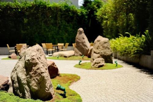 a garden with rocks and birds on a path at Hyatt Regency Mexico City in Mexico City