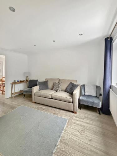 a living room with a couch and a chair at Amaya Three - Newly Renovated - Sleeps 6 - Grantham - Garden & Driveway in Grantham