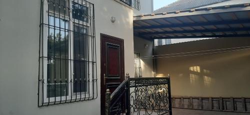 an entrance to a building with a gate and a door at My sweet home in Ramana in Baku