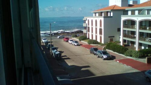 a view of a street with cars parked in a parking lot at Apto Punta del Este in Punta del Este