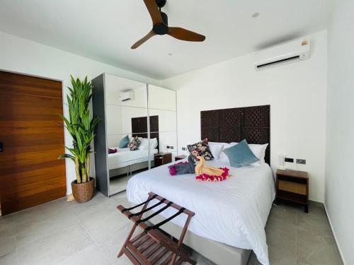 a bedroom with a bed with two dolls on it at Baan Saint-Tropez Seaview Villa Ko Samui Private Villa in Bophut 