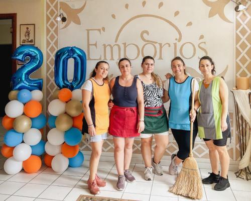 a group of women standing in front of a balloon wall at Emporios Bay Hotel Chios in Emporeios