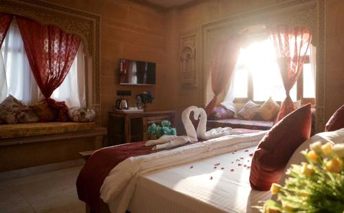 Postel nebo postele na pokoji v ubytování Hotel Golden Signature