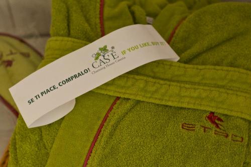 a tag is attached to a green shirt at Cas'E Charming House in Caserta