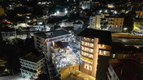 a view of a city at night at Hotel Dior in Krujë