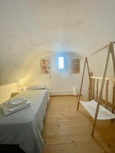 a bedroom with a bed and a window in it at Aliki's Apartments in Vóthon