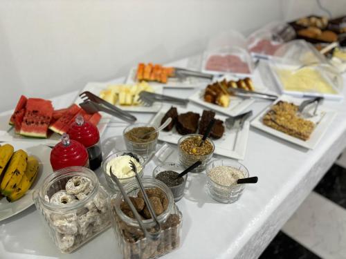 a table with many different types of food on it at Hotel São Luis in Pinhão