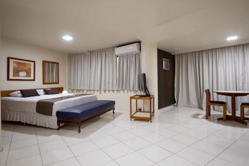 Uberaba Apart Hotel by Easy Hotéisにあるベッド