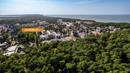 a sign that says western air on top of a city at Westerplatte, Sun & Snow in Międzywodzie