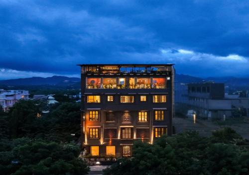 a tall building with its lights on at Kudos-My Downtown Hotel in Udaipur