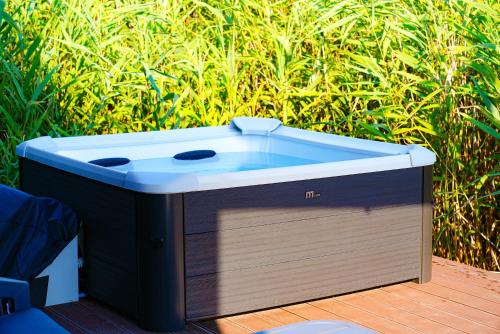 a blue and white cooler sitting on a wooden deck at Amazonas Pirates 4 in Gornji Štoj