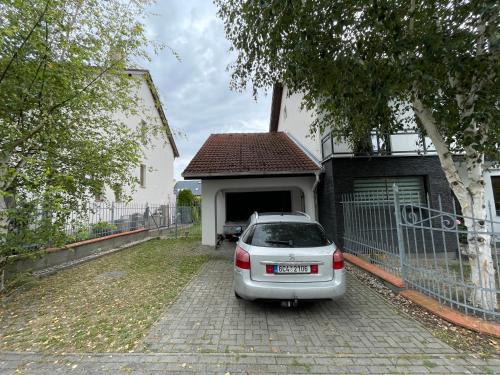 a car parked in front of a house at At The Top - pokoj s terasou in Hrdějovice