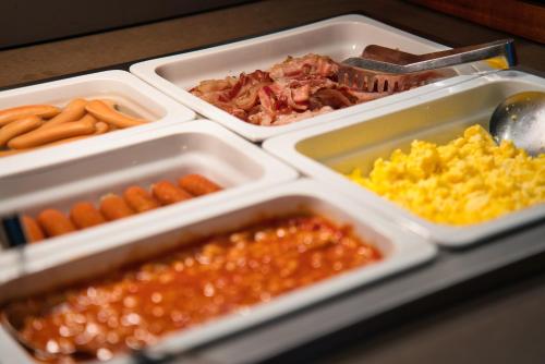 a tray of food with different types of food at IntercityHotel Graz in Graz