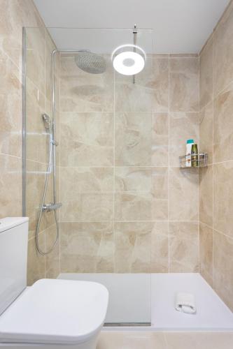 a bathroom with a shower and a toilet at Estudio Paraiso del Sur in Playa Paraiso