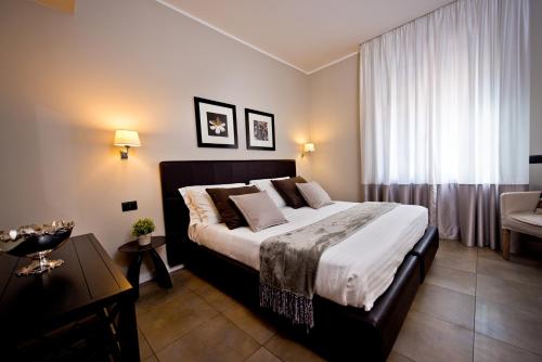 Delle Vittorie Luxury Rooms&Suitesにあるベッド