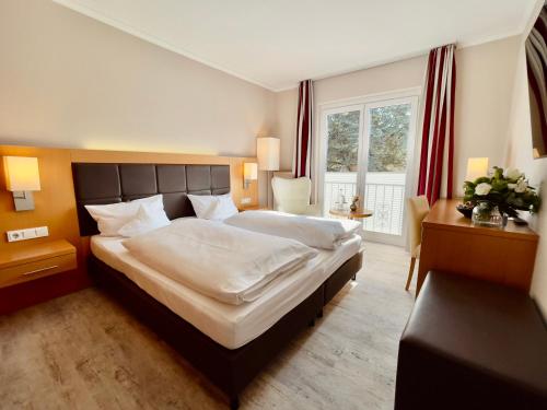Postel nebo postele na pokoji v ubytování Moin Hotel Cuxhaven