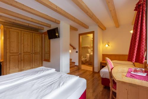 Monza Dolomites Hotelにあるベッド