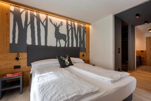 Monza Dolomites Hotelにあるベッド