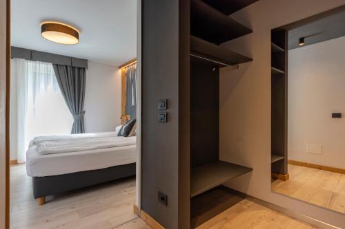 Monza Dolomites Hotelにあるベッド
