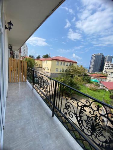 a balcony with a view of a city at Black Sea Pearl in Makhinjauri