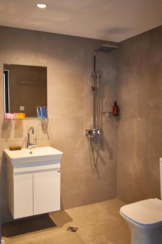 a bathroom with a sink and a toilet at Studio Rosa in Gabrovo