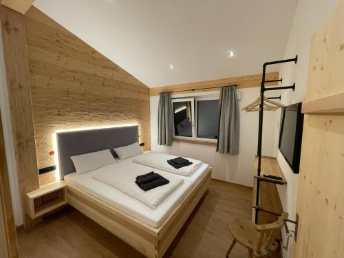 Katil atau katil-katil dalam bilik di Stadl Lodge Hinterstein - Skipass im Winter und Bergbahnen im Sommer inklusive